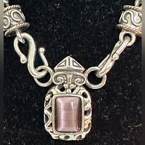 The Royal Necklace silver plated with a stone the color of Amethyst